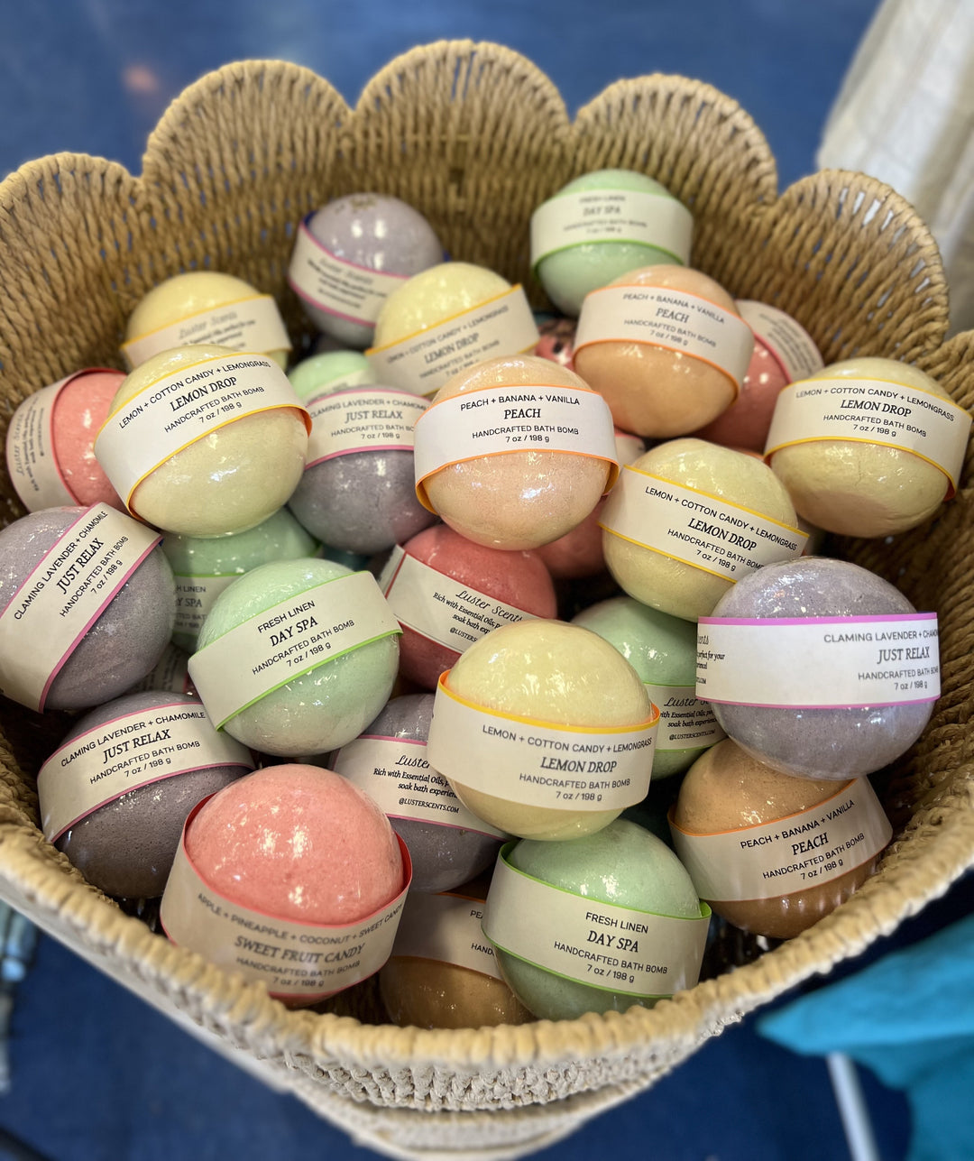 Basket filled with colorful bath bombs labeled 'Just Relax' and 'Day Spa'.